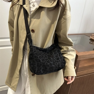 Large black leopard print canvas tote bag with adjustable wide shoulder strap for women