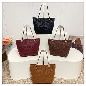 Detail display of four leopard print tote bags in black, wine red, coffee and camel colors