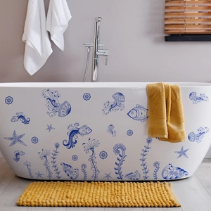 Blue marine animal wall decals featuring jellyfish and starfish on a white bathtub surface