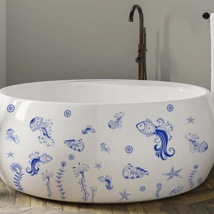Detailed blue sea life wall decals shown on a white bathtub in a modern bathroom
