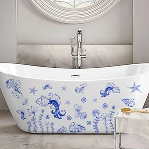 Blue marine sea life stickers featuring fish and jellyfish applied to a white bathtub side