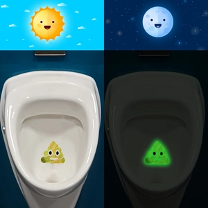 Luminous poop emoji toilet sticker showing glow in the dark effect for bathroom decor