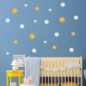 Daisy wall stickers in white and orange for nursery wall decor on blue background
