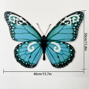Detalle de mariposa 3D azul de 40cm para pared con diseños de filigrana calados