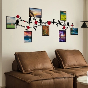 Bird tree branch wall sticker with natural landscape frames over brown leather sofa