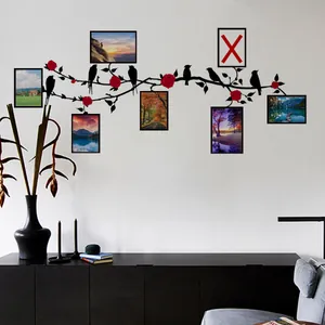 Detail of bird and vine photo wall decal with 7 rectangular frames and red rose flowers