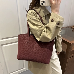 Fashionable burgundy leopard pattern tote bag in suede texture with long shoulder straps