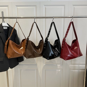 Glossy patent leather shoulder bags in caramel, burgundy, black, and dark brown colors