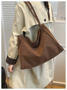 Brown leopard print suede tote bag styled over the shoulder for commute look