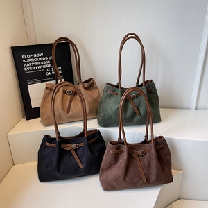 Minimalist large capacity tote bags in matte finishes with leather handles and buckle detail