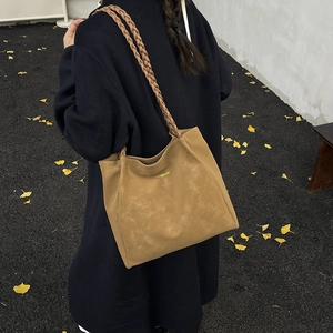 Brown matte tote bag with braided shoulder straps and large capacity for daily use