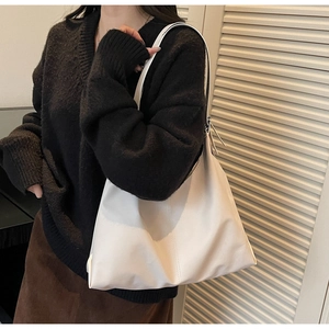 Minimalist large white tote bag shown with an elegant urban outfit for a chic look