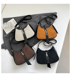 Detail view of crescent shoulder bags in four colors with mixed suede and leather textures