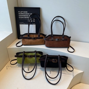 Vintage suede shoulder bags with metal buckle detailing in four assorted retro colors