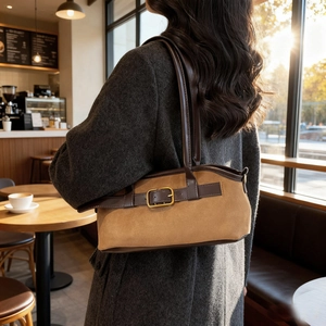 Vintage brown suede shoulder bag with gold buckle and leather trim for autumn styling