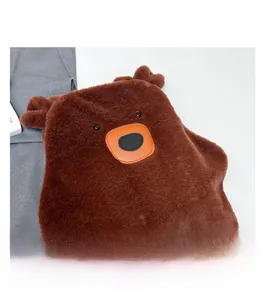 Detail showing plush brown bear shoulder bag texture and leather muzzle decoration
