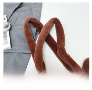 Detail of plush brown capybara shoulder bag showing soft faux fur wide handle texture