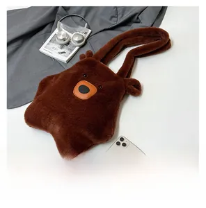 Detailed view of the soft brown plush bear tote bag texture and cute embroidered face features