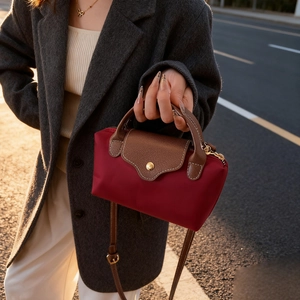 Chic burgundy nylon mini square bag with contrast brown leather handles and gold hardware