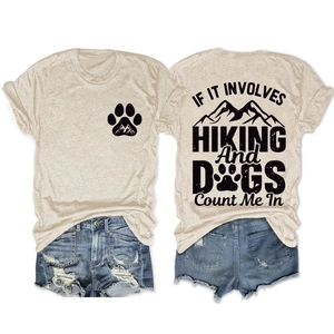 Detail of hiking and dog theme graphic print on a beige crew neck short sleeve t-shirt