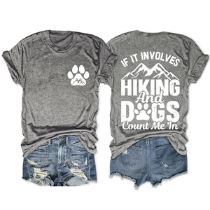 Detail view of heather grey t-shirt featuring mountain and dog hiking prints on both sides