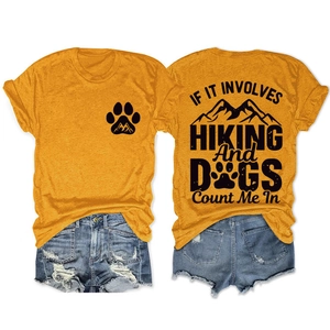 Detail view of orange T-shirt with hiking and dog print on front and back sides