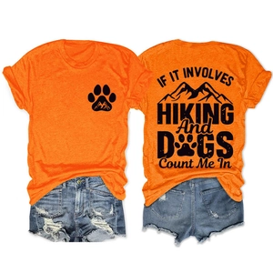 Detail view of orange hiking t-shirt with dog mountain print and denim shorts