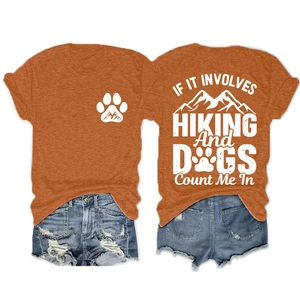 Front and back view of orange hiking t-shirt with dog paws and mountain print details
