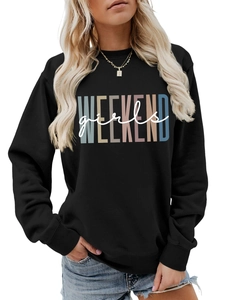 Detail of loose black crewneck sweatshirt featuring colorful Weekend Girls graphic print