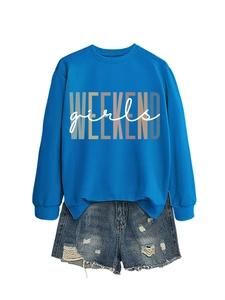 Detail of royal blue sweatshirt with 'WEEKEND girls' print and distressed denim shorts