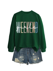 Flat lay of green WEEKEND girls sweatshirt paired with distressed denim shorts