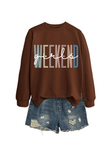 Detail view of Weekend Girls sweatshirt paired with distressed denim shorts on white background