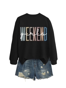 Flat lay of black crewneck sweatshirt with Weekend Girls print and ripped denim shorts