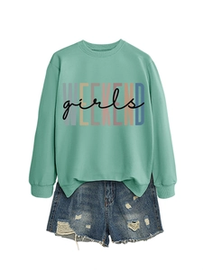 Detail of mint green sweatshirt with WEEKEND girls print and ripped denim shorts