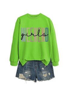 Detail of green Weekend Girls sweatshirt with ribbed cuffs and ripped denim shorts