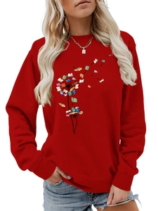 Detail of red crewneck sweatshirt with creative dandelion book print and sleeve cuffs