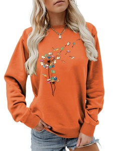 Detail of orange crewneck sweatshirt with creative dandelion book graphic and ribbed cuffs