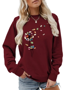 Close-up of dandelion book print on wine red long sleeve crewneck sweatshirt for women