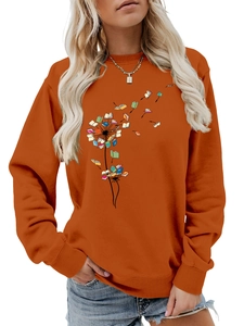 Detail view of ribbed cuffs on an orange dandelion book print long sleeve sweatshirt