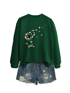 Detail of artistic dandelion book print on dark green long sleeve crewneck sweatshirt