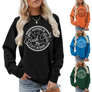 Close-up of crewneck sweatshirts in black, orange, blue, and green with book club prints