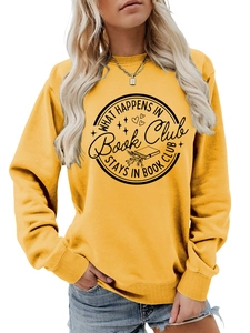 Detail of What Happens in Book Club slogan print on yellow long sleeve crewneck sweatshirt