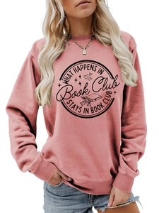 Detail of pink crewneck sweatshirt with What Happens in Book Club print and ribbed cuffs