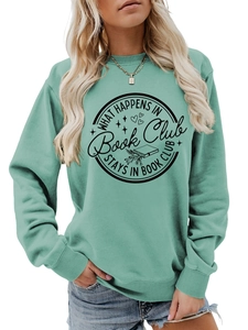Detail of mint green sweatshirt featuring What happens in Book Club stays in Book Club print