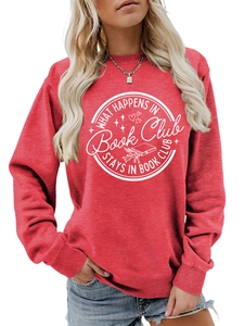 Detail of red crewneck sweatshirt featuring white What Happens in Book Club slogan print