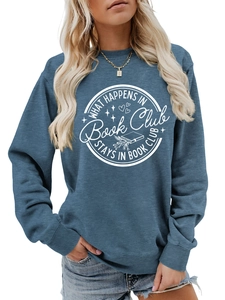 Detail of greyish blue crew neck sweatshirt featuring What Happens in Book Club slogan