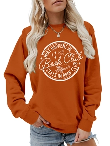 Detail of orange sweatshirt featuring white Book Club graphic print and ribbed cuffs