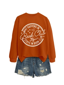 Detail of orange sweatshirt with Book Club print and distressed denim shorts flat lay