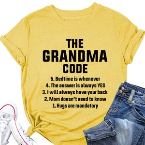 Close-up of yellow cotton t-shirt featuring black THE GRANDMA CODE slogan print