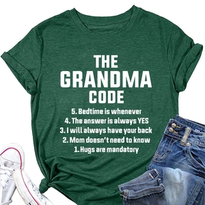 Flat lay of a dark green t-shirt with Grandma Code print, denim shorts and sneakers